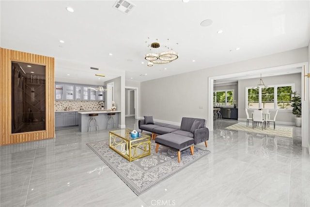 living room featuring a notable chandelier