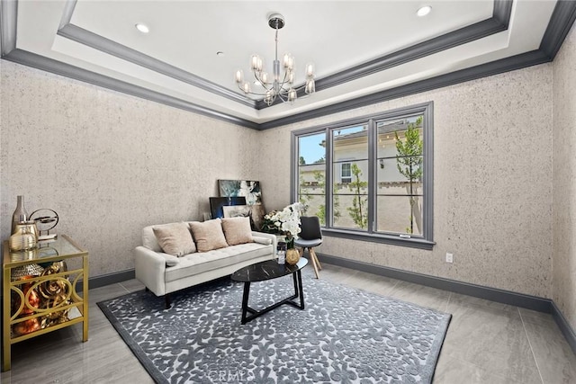 living room with a tray ceiling, crown molding, and a chandelier