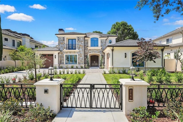 mediterranean / spanish house featuring a garage