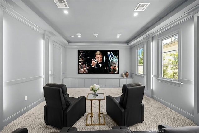 cinema room featuring light carpet and ornamental molding