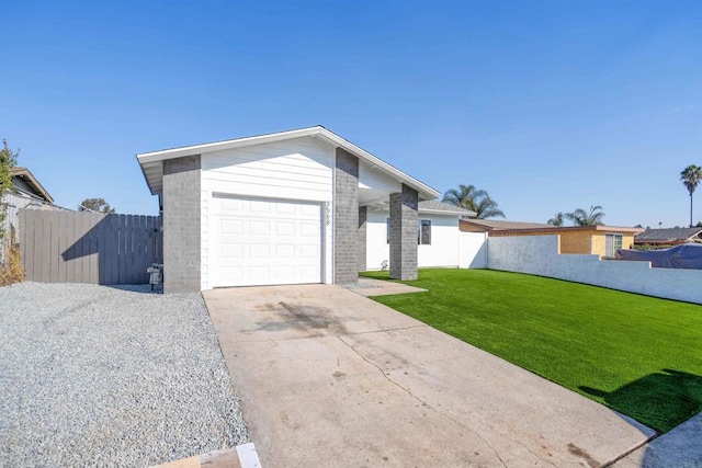 single story home featuring a front yard and a garage