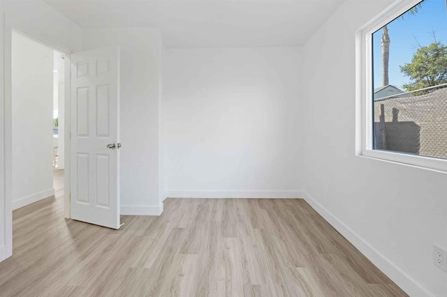 unfurnished room featuring light wood-type flooring