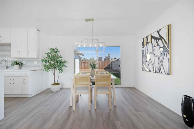 dining space featuring light wood-type flooring