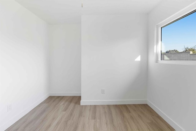 spare room featuring light wood-type flooring