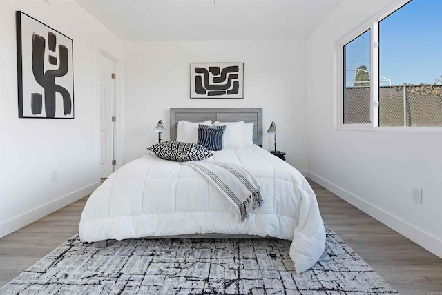 bedroom featuring wood-type flooring