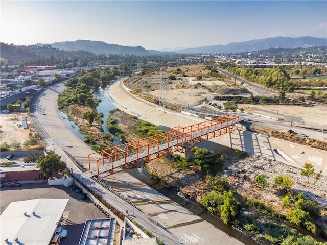 birds eye view of property featuring a mountain view