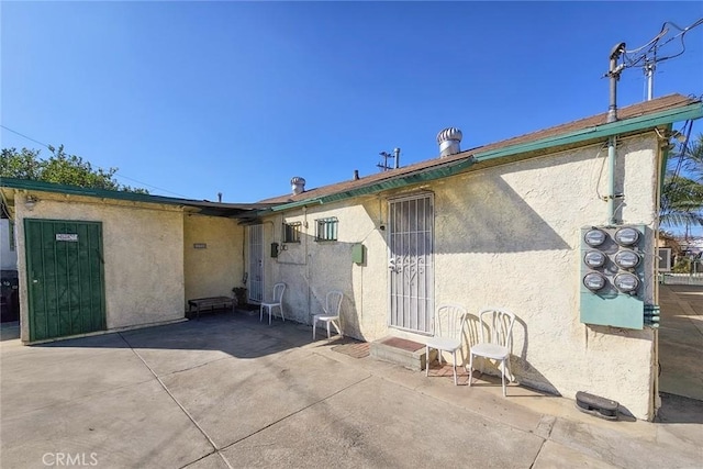 rear view of property with a patio