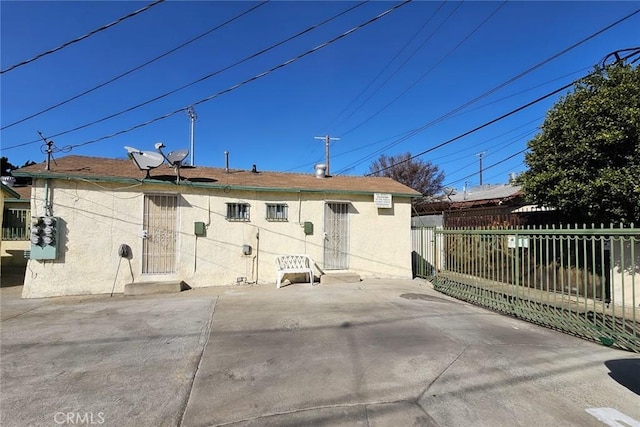 back of house with a patio