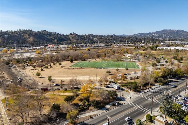 birds eye view of property with a mountain view