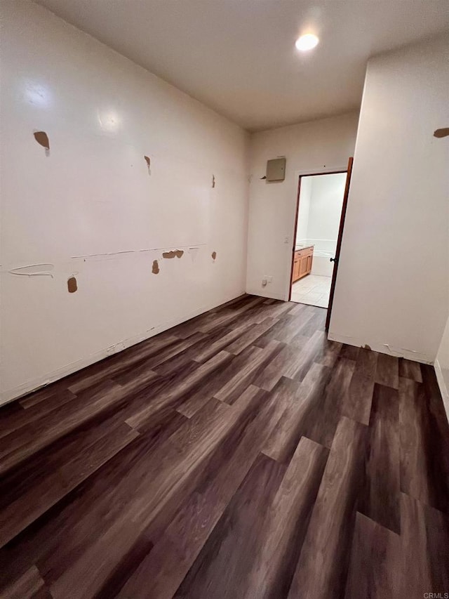 unfurnished room featuring dark hardwood / wood-style floors