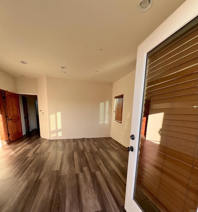 interior space with dark hardwood / wood-style floors