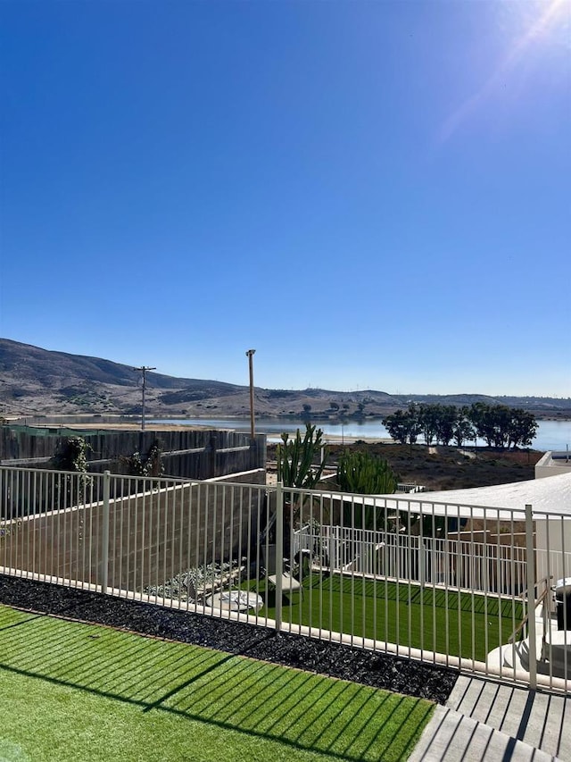 exterior space featuring a water and mountain view