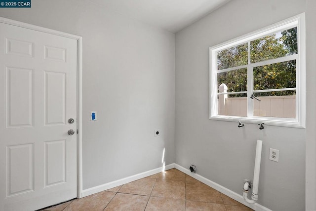 washroom featuring light tile patterned floors and electric dryer hookup