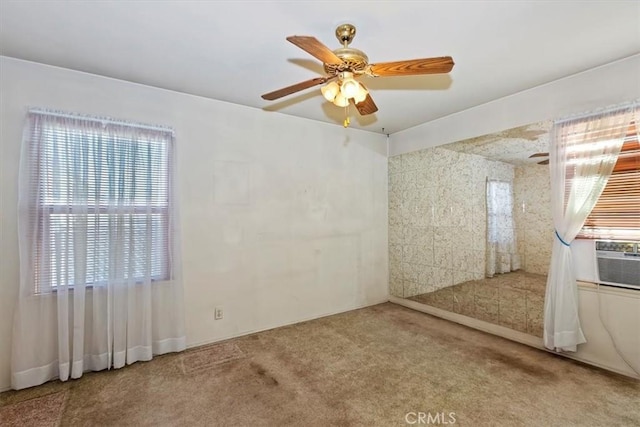 carpeted empty room with cooling unit and ceiling fan