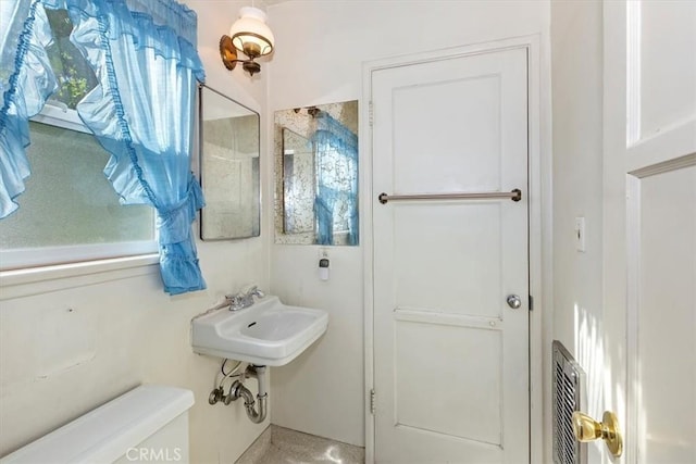 bathroom with sink and toilet