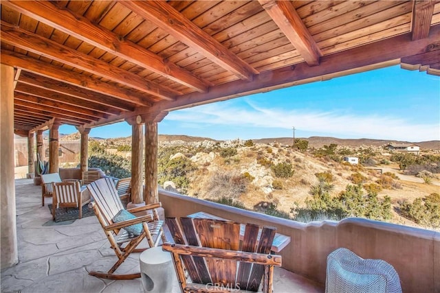 view of patio / terrace with a mountain view