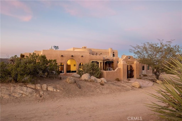 view of pueblo revival-style home