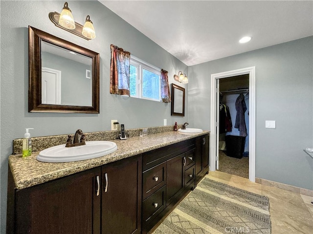 bathroom with vanity and tile patterned flooring