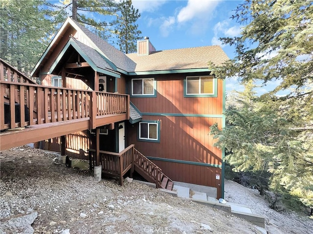 back of property featuring a wooden deck