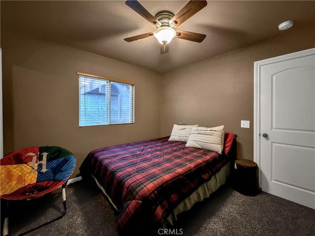 bedroom with ceiling fan and carpet