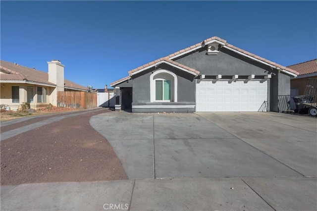 ranch-style home featuring a garage