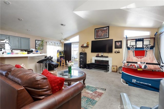 living room with ceiling fan, light colored carpet, and lofted ceiling