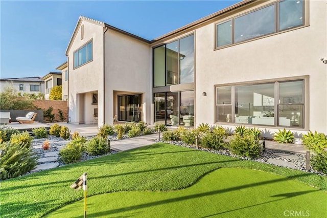 rear view of house featuring a patio