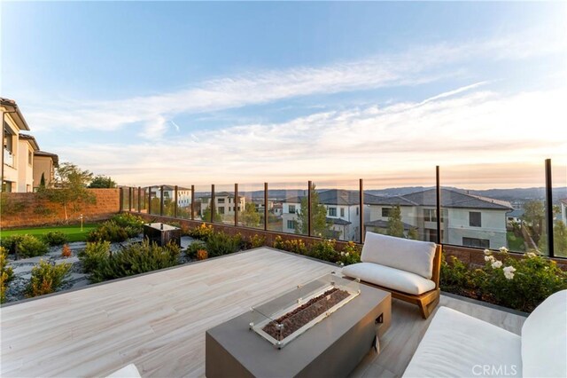 patio terrace at dusk with a fire pit