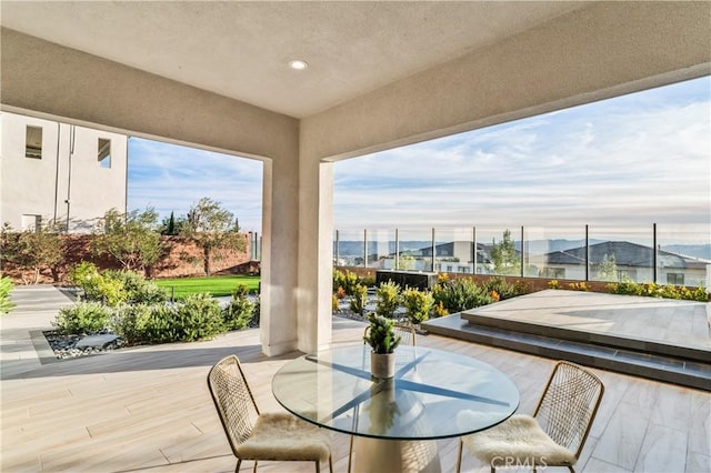 sunroom featuring a mountain view