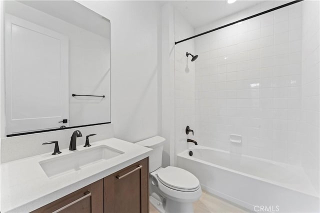 full bathroom with vanity, shower / tub combination, and toilet