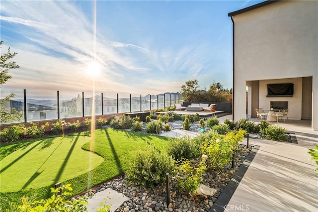 view of community featuring an outdoor living space and a patio