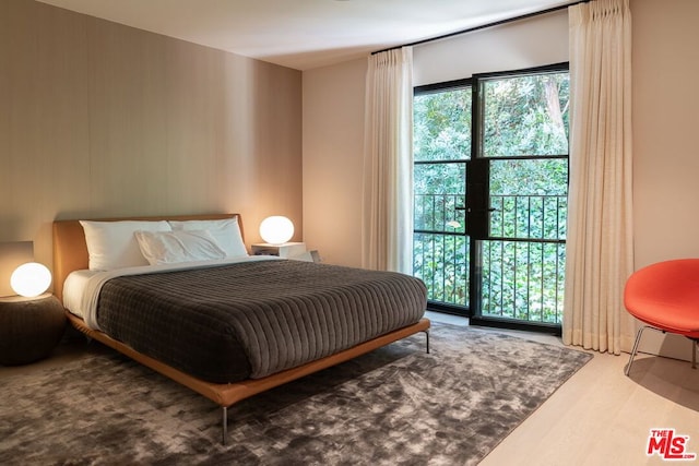 bedroom with wood-type flooring