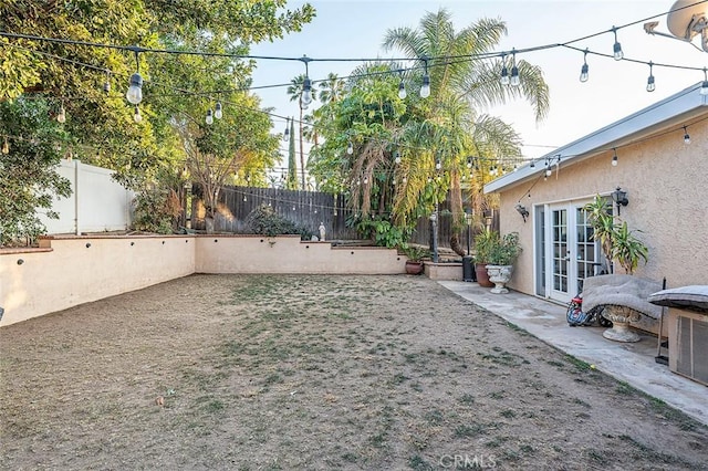 view of yard featuring french doors