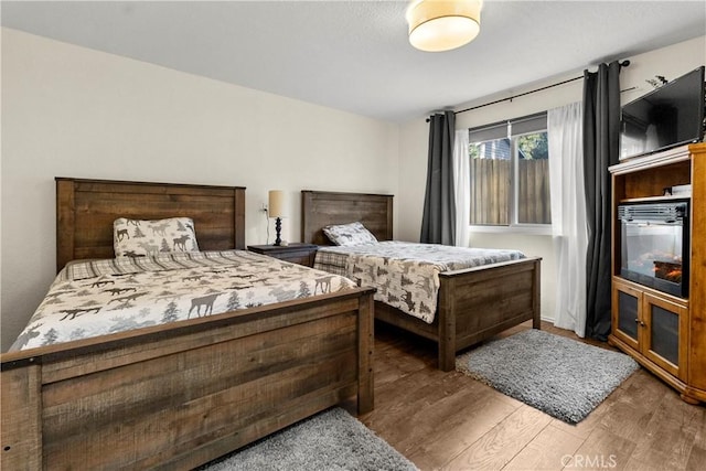 bedroom featuring dark hardwood / wood-style flooring