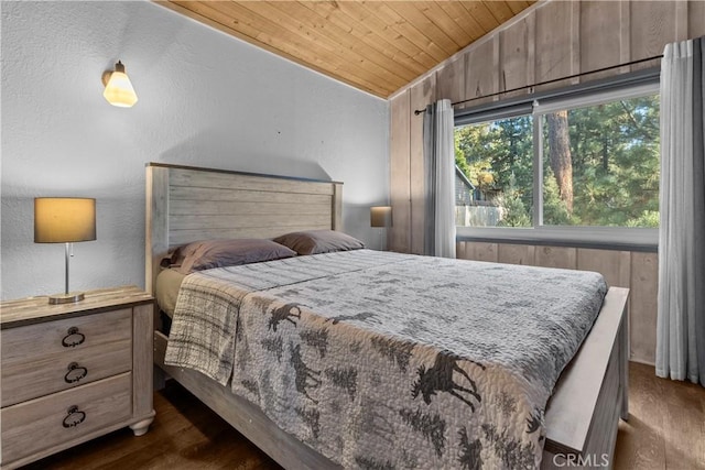 bedroom featuring wood ceiling, vaulted ceiling, and dark hardwood / wood-style floors