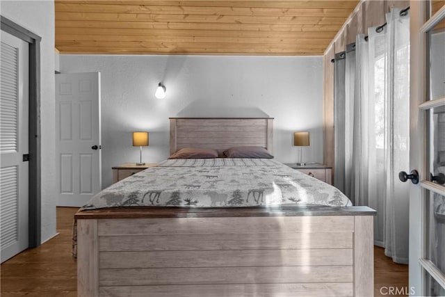 bedroom featuring wood ceiling and wood-type flooring