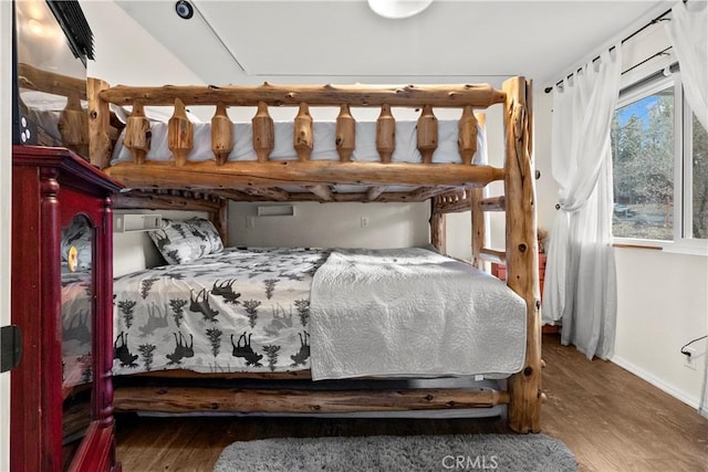 bedroom with wood-type flooring