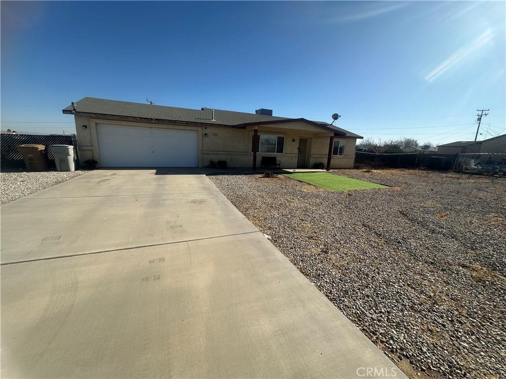 ranch-style house featuring a garage