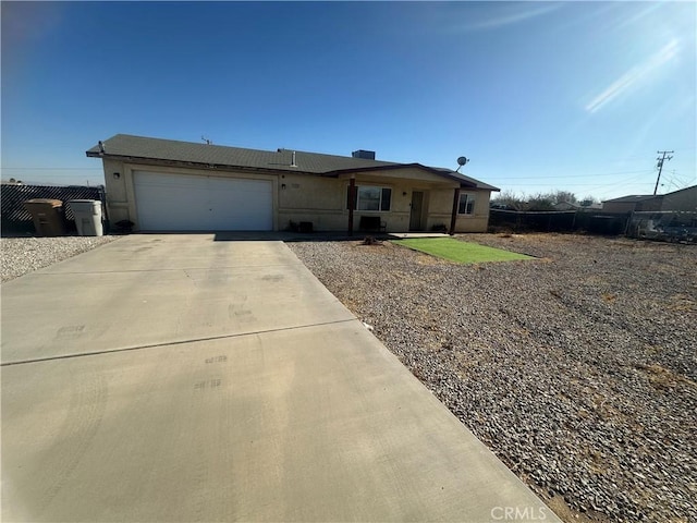 ranch-style house featuring a garage