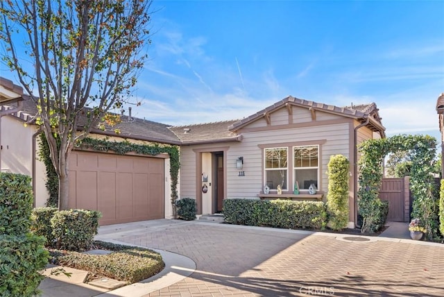 single story home featuring a garage