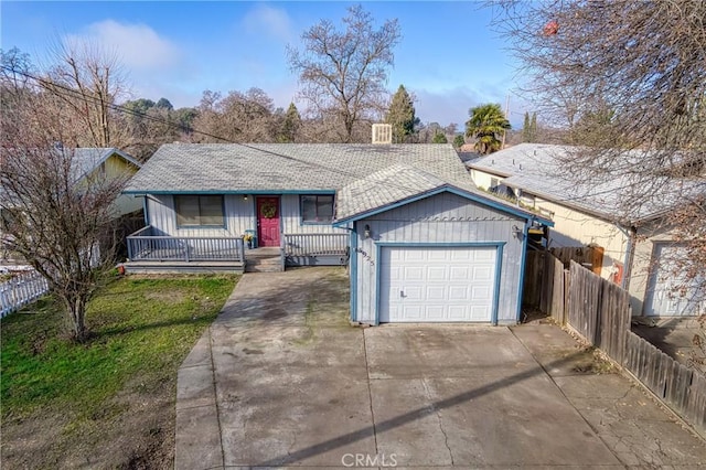 ranch-style home with a front yard, a garage, and a porch