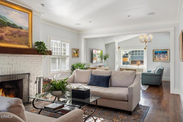 living room featuring dark hardwood / wood-style floors, crown molding, and a fireplace