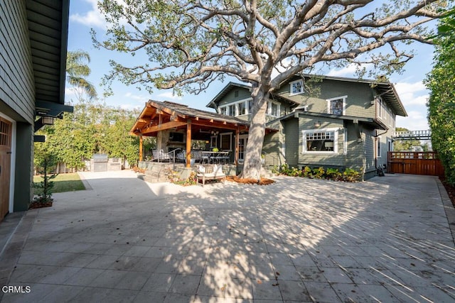 rear view of house featuring a patio