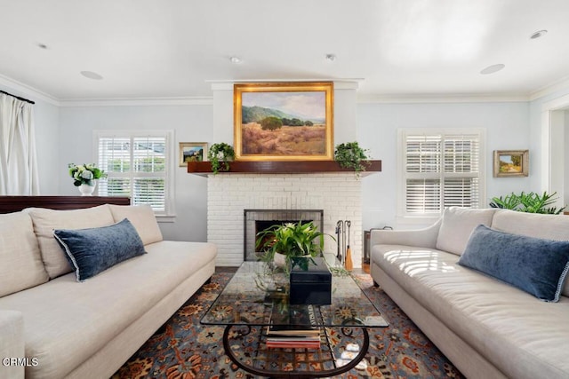 living room featuring crown molding and a fireplace