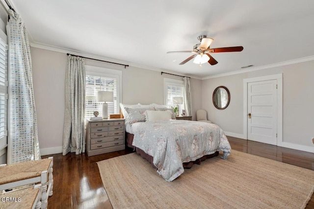 bedroom featuring ceiling fan, crown molding, and dark hardwood / wood-style floors