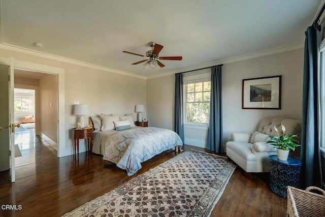 bedroom with dark wood-type flooring, ceiling fan, and ornamental molding