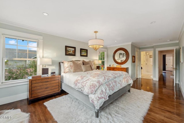 bedroom with dark hardwood / wood-style flooring and crown molding