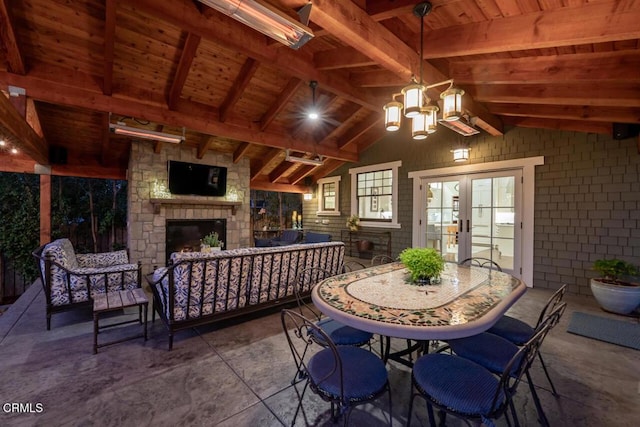 view of patio featuring an outdoor living space with a fireplace and french doors