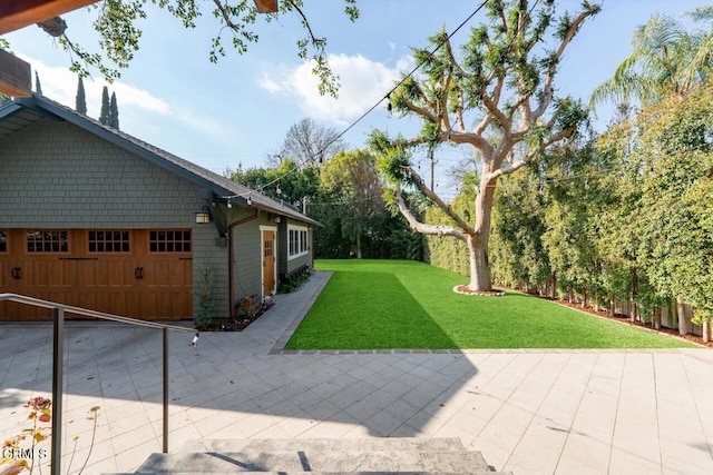 view of yard with a garage