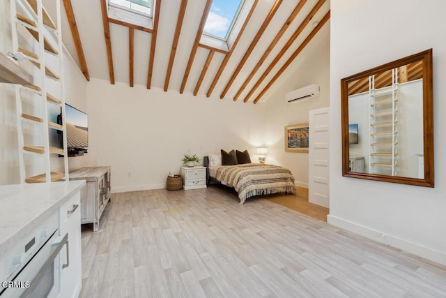 bedroom with high vaulted ceiling, a wall mounted AC, a skylight, and light hardwood / wood-style flooring